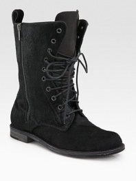 Edgy, combat-inspired look modernized by an extravagant pony hair upper, topped off with a side zipper and lace-up front. Pony hair upper Leather lining and sole Padded insole Made in ItalyOUR FIT MODEL RECOMMENDS ordering true size. 