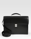Double-gusset briefcase with detachable shoulder strap, constructed from smooth leather with a secure combination lock and stainless steel metal accents for a shiny finish.Top handleFlap closure with lockAdjustable shoulder strapLeather16½W x 12½H x 4¾DImported