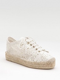 A pretty yet relaxed combo of a sneaker and an espadrille, with a lacy crocheted cotton upper on a rope-edged platform.Rope-covered heel, 1½ (40mm) Rope-edged platform, 1¼ (30mm) Compares to a ¼ heel (5mm) Crocheted cotton upper Partial leather lining Padded insole Rubber sole Made in SpainOUR FIT MODEL RECOMMENDS ordering one half size up as this style runs small. 