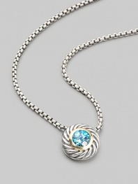 From the Color Classic Collection. A swirled sterling silver cookie pendant, with a faceted center of shimmering blue topaz, on a bold box chain. Blue topaz Sterling silver Chain length, about 16 Pendant diameter, about ½ Lobster clasp Imported