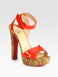 Sky-high heel and platform in an abstract print, finished with vibrant patent leather straps and a signature red leather sole. Self-covered heel, 5½ (140mm)Covered platform, 1 (25mm)Compares to a 4½ heel (115mm)Patent leather upperLeather liningSignature red leather solePadded insoleMade in Italy