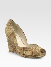 Snake-embossed metallic leather wedge with a low-cut front and subtle peep toe. Self-covered wedge, 5 (125mm)Covered platform, ½ (15mm)Compares to a 4½ heel (115mm)Snake-embossed metallic leather upperLeather liningBuffed leather solePadded insoleImported