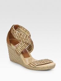 Woven straw and leather straps grounded by an espadrille wedge and comfortable rubber sole. Hemp-covered wedge, 3 (75mm)Hemp-covered platform, ½ (15mm)Compares to a 2½ heel (65mm)Leather and straw upperLeather and straw liningRubber soleImportedOUR FIT MODEL RECOMMENDS ordering true size. 