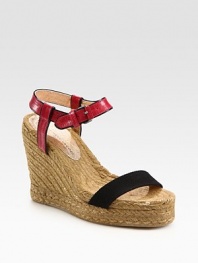 Braided hemp wedge with an adjustable leather ankle strap and contrasting canvas strap. Hemp wedge, 4 (100mm)Hemp platform, 1 (25mm)Compares to a 3 heel (75mm)Leather and canvas upperRubber soleImportedOUR FIT MODEL RECOMMENDS ordering true whole size; ½ sizes should order the next whole size down. 