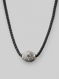 Stunning texture enlivens a gleaming silver pendant strung on braided leather. Sterling silver ¾ X 1 Necklace, about 18 Imported