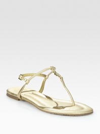 Crafted with an adjustable slingback strap and a rubber sole, this metallic leather flat has a goldtone designer emblem and classic thong front. Metallic leather upperLeather liningRubber solePadded insoleImportedOUR FIT MODEL RECOMMENDS ordering one half size down as this style runs large. 