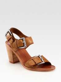 Oversized buckles and an adjustable slingback strap characterize this supple leather design. Stacked heel, 3 (75mm)Leather upperLeather lining and solePadded insoleImported