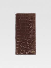 A travel essential crafted of crocodile-embossed Italian calfskin, this handsome design has a ticket compartment, six credit card slots and one slot for passport. Keeps all travel papers organized and handy About 3½ X 9¼ Made in USAFOR PERSONALIZATIONSelect a color and quantity, then scroll down and click on PERSONALIZE & ADD TO BAG to choose and preview your personalization options. Please allow 2 to 3 weeks for delivery.