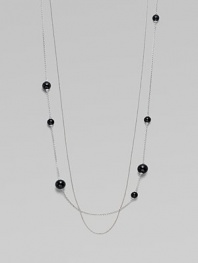 A long, delicate piece with beautiful round black agate stations on one of the two sterling silver link chains. Black agateSterling silverLength, about 39¾Clasp closureImported 