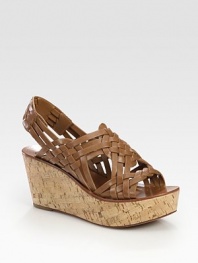Brilliantly braided leather straps grounded by a natural cork wedge. Cork-covered wedge, 3 (75mm)Cork-covered platform, 1 (25mm)Compares to a 2 heel (50mm)Leather upperLeather liningRubber soleImportedOUR FIT MODEL RECOMMENDS ordering one half size up as this style runs small. 