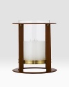 Crafted from gleaming glass, and encased in a supple saddle leather frame to evoke a heritage panache.12 L x 14¼ H6 X 6 candle recommendedLeather, glass and brassImported