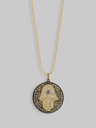 The hamsa, or open hand, a graceful symbol of protection in many cultures, becomes a shimmering necklace, set with diamonds and a single sapphire, on a diamond pavé medallion hanging from a gold ball chain. Diamonds, 0.43 tcw Sapphire, 0.05 ct 14k yellow gold Chain length, about 16 Medallion diameter, about ½ Lobster clasp Imported