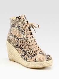Classic ankle-grazing silhouette modernized by a snake-print faux leather upper, lace-up front and an espadrille wedge. Braided hemp wedge, 4 (100mm)Braided hemp platform, 1 (25mm)Compares to a 3 heel (75mm)Snake-print faux leather and burlap upperRubber solePadded insoleMade in SpainOUR FIT MODEL RECOMMENDS ordering true whole size; ½ sizes should order the next whole size up. 