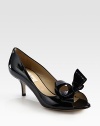Simply divine patent leather with a kitten heel, peep toe and oversized bow adornment. Self-covered heel, 2½ (65mm)Patent leather upperLeather lining and solePadded insoleMade in Italy