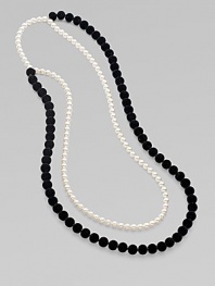 From the Night Blue Collection. This high contrast piece features strands of flocked velvet beads and pearlized glass beads. Length, about 45½ Slip-on style Imported 
