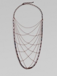 From the Art Deco Collection. A delicate but powerful web of crisscrossed chains edged by bold rectangular beads evokes a femme fatale look from the golden age of Hollywood.Hand-stained copperLength, about 17¾Lobster claspMade in USA