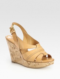 Natural cork wedge with rich leather straps and an adjustable slingback. Cork wedge, 4 (100mm)Cork platform, 1 (25mm)Compares to a 3 heel (75mm)Leather upperLeather lining and solePadded insoleMade in ItalyOUR FIT MODEL RECOMMENDS ordering one half size up as this style runs small. 