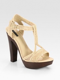 Wondrously woven raffia t-strap design with an adjustable ankle strap and wooden heel. Wooden heel, 5½ (140mm)Wooden platform, 1 (125mm)Compares to a 4½ heel (115mm)Raffia upperLeather liningRubber solePadded insoleImportedOUR FIT MODEL RECOMMENDS ordering one half size down as this style runs large. 