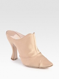 Shimmering satin in a classic silhouette with a unique contoured heel. Self-covered heel, 4 (100mm)Satin upperLeather lining and solePadded insoleMade in ItalyOUR FIT MODEL RECOMMENDS ordering one size up as this style runs small. 