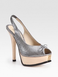 Metallic snakeskin coils around this sexy platform design, concluding with an embedded designer emblem and a secure slingback strap. Self-covered heel, 5 (125mm)Island platform, 1 (25)Compares to a 4 heel (100mm)Metallic snakeskin upperLeather liningBuffed leather solePadded insoleMade in Italy