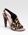 Classic leopard-print calf hair in an asymmetrical design with a high heel and toe ring. Calf hair-covered heel, 4½ (115mm)Leopard-print calf hair upperLeather lining and solePadded insoleImported