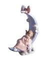 Sweet dreams. A little angel cuddles up to a crescent moon in the Heavens Lullaby figurine, featuring delicately glazed porcelain from Lladro.