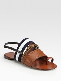 Perforated, braided leather straps accompanied by a nautical canvas strap and a unique toe ring. Leather and canvas upperLeather lining and soleMade in ItalyOUR FIT MODEL RECOMMENDS ordering one half size up as this style runs small. 