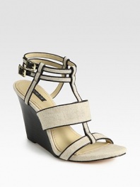 Textured linen t-strap design with leather trim, adjustable ankle straps and a stacked wedge. Stacked wedge, 4 (100mm)Linen and leather upperLeather lining and solePadded insoleImportedOUR FIT MODEL RECOMMENDS ordering true size. 