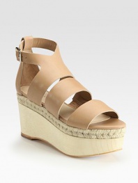 Adjustable, smooth leather straps accompanied by a wooden, espadrille-inspired wedge and platform. Wooden wedge, 3 (75mm)Wooden platform, 2 (50mm)Compares to a 1 heel (25mm)Leather upperLeather liningBuffed leather solePadded insoleImportedOUR FIT MODEL RECOMMENDS ordering true size. 