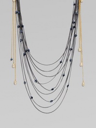 Delicate chains in two tones and varying lengths fall gracefully in this striking bib-style necklace, dotted with faceted glass beads and accented with dangling rhinestone-studded ovals.GlassBrassLength, about 36Imported