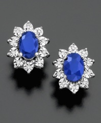Royalty-inspired studs. Oval-cut sapphire (1-1/3 ct. t.w.) encircled by sparkling diamond accents lends a regal look to these 14k white gold earrings. Approximate diameter: 1/4 inch.