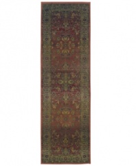 This long runner is ideal for hallways and entryways. A truly charming interpretation of a traditional carpet, this rug features a center medallion ringed by palmettes and floral details in sage green, topaz and slate blue against a rich burgundy ground. Striated effects create the weathered look of handmade rugs in a stain-resistant, no-shed manmade fiber.