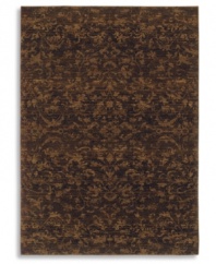 Crafted to impart a vintage wear and lush visual texture, this Karastan rug features subtle fabric-like patterning inspired by the organic designs found in granite and marble. Machine woven from 100% wool in a rich espresso hue.