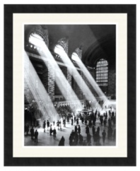 Give any room an artful, urban flair with this black-and-white photography print of Grand Central Station. With warm rays of light streaming in from above, the bustling hub of New York City looks almost peaceful.