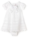 Eyelet lace details and fancy bows elevate this Juicy baby-chic dress.
