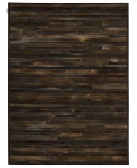 Western chic. Invite sumptuous style into your home with the one-of-a-kind Prairie rug from Calvin Klein. Tonal bars of rich cowhide are hand-tufted in an alternating pattern to create a stunning, mosaic-like appearance and a divinely textured feel.