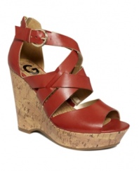 Strap happy! Kick off warm weather in style with G by GUESS' Passage platform sandals. Featuring an ankle strap, they include a high cork wedge heel as well as a back zipper.