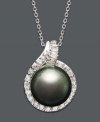 Indulge yourself in a taste of the exotic. An iridescent, cultured Tahitian pearl is enveloped by a halo of sparkling round-cut diamonds (1/2 ct. t.w.). Set in 14k white gold. Approximate length: 18 inches. Approximate drop: 1 inch.