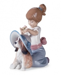 Just a flower away from best in show, this patient pooch takes her makeover in stride, indulging her owner's dress-up dreams in this irresistible Lladro figurine.
