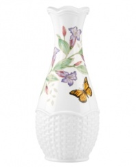 Crafted of elegant white porcelain, this Lenox bud vase combines the beloved Butterfly Meadow motif with a scalloped edge and textured accents for a look of country charm. Qualifies for Rebate