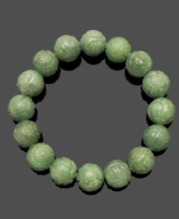 Good style and good luck. This beaded bracelet combines intricately-carved jade beads (11-12 mm) in a chic stretch design. Approximate length: 7 inches.