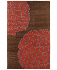 In full bloom. This artist-designed area rug from Surya features whimsical florals set in a palette of deep, rich colors. Hand-tufted from exceptionally soft New Zealand wool, the brilliant use of high and low pile adds texture and dimension.