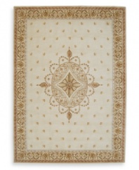 A long runner that is ideal for hallways and entryways. Evoking the opulence of European decor, this rug features an elegant medallion design in shades of gold on a cream background dotted with rosettes. Woven of premium wool for rich texture and indulgent softness.