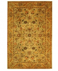 Lavish your space in timeless tradition, set in soft shades of sage on this exquisite area rug from Safavieh. Tufted in India from pure wool, this rug emerges from the annals of antiquity to bring spectacular style and time-honored quality to your home. (Clearance)