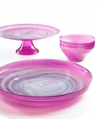 Adding a fun shock of color to modern settings, the large Sweet Plum dish from Sea Glasbruk pairs luminous violet with swirls of white in handcrafted glass.