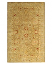 Lavish your space in timeless tradition, set in soft, earthy shades on this exquisite area rug from Safavieh. Tufted in India from pure wool, this rug emerges from the annals of antiquity to bring spectacular style and time-honored quality to your home. (Clearance)