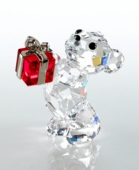 Pronounce staggering emotion to someone special with this adorable gift-toting bear. Designed by Peter Heidegger for Swarovski, this lovable fellow is crafted of fully faceted clear crystal with Jet-crystal eyes and nose and a Light Siam crystal present. The perfect gift for birthdays, holidays or an extra sweet thank-you. Meaures 1.5 x .75. Swarovski logo on bottom right foot.