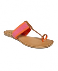 Beach chic. Protect your feet from the red-hot sand, or slip them on after a cool dip. Tommy Hilfiger's Lilly thong flat sandals are a must-have for the summer.