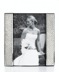 Display a wedding photo with the glitz and glam it deserves in this silver-plated picture frame from Leeber. Clear crystals add extravagant shine to happy memories.