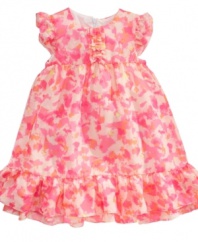 Fabulous floral. This frilly dress from DKNY will make her as pretty as a freshly-picked flower.